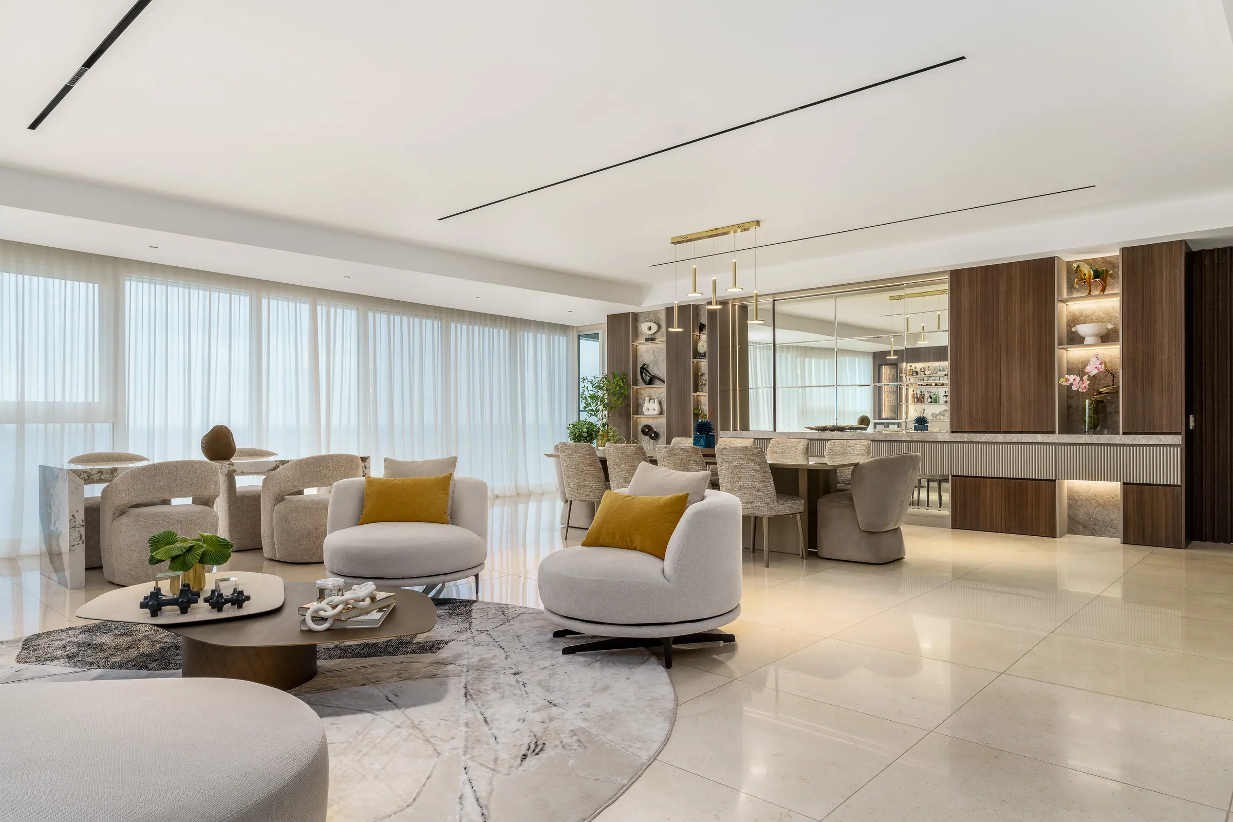 Sala con mueble bar y mesón de mármol diseñada y fabricada por Boceto